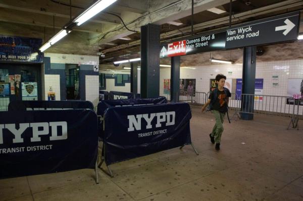 Two people snuck onto an empty train at a Queens subway station and briefly operated it before crashing, according to police.